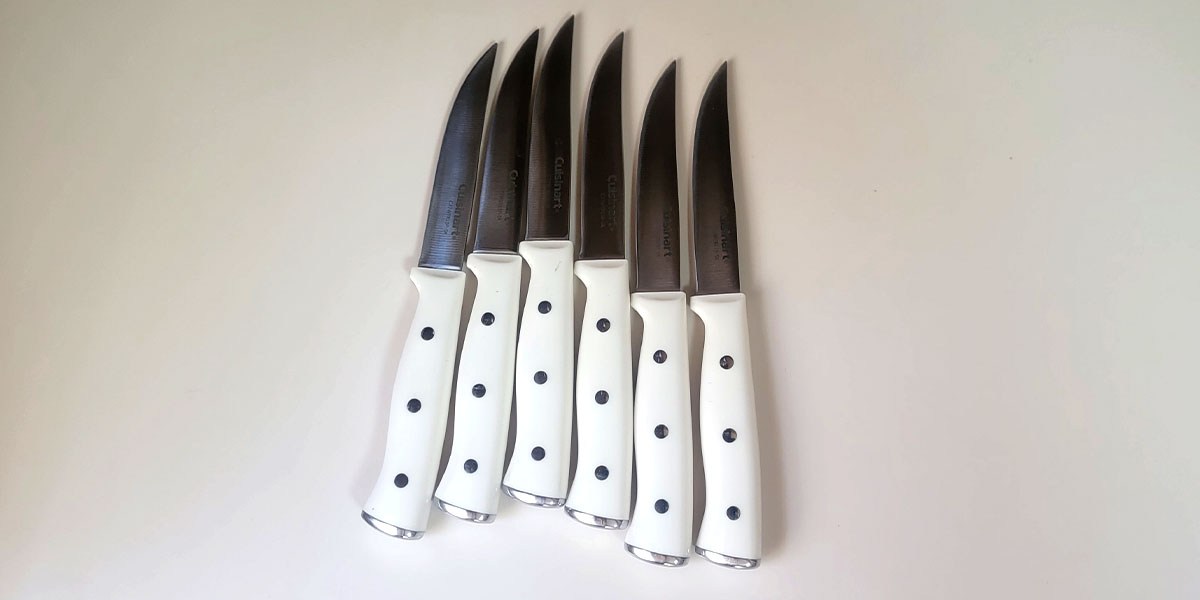 Cuisinart 15-Piece Knife with Block knives with white handle on counter Cuisinart 15-Piece Knife with Block knives with white handle on counter