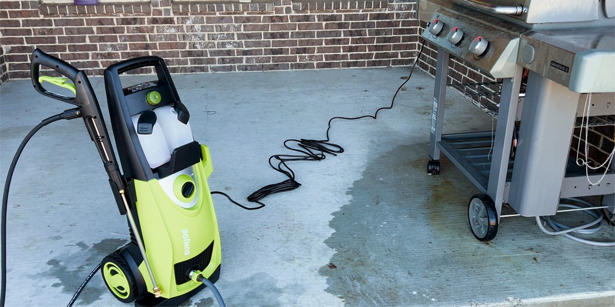 Sun Joe SPX3000 on pavement next to grill Sun Joe SPX3000 on pavement next to grill