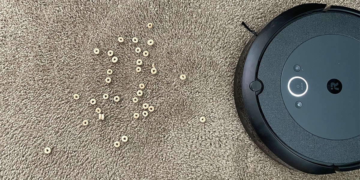 Roomba cleans cereal  on carpet