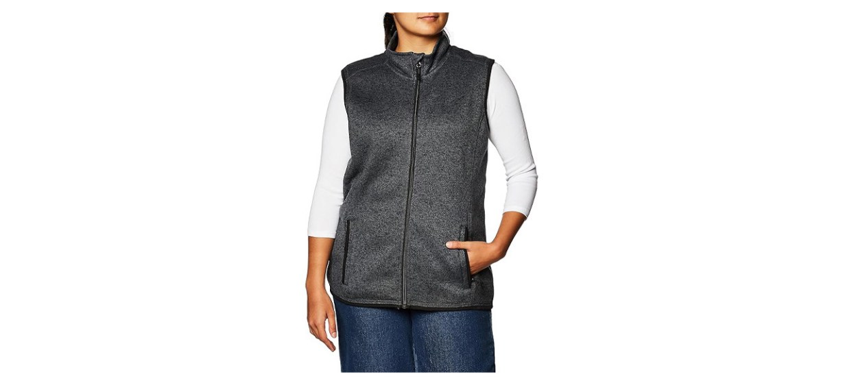 Person wearing sweater fleece vest with hand in pocket