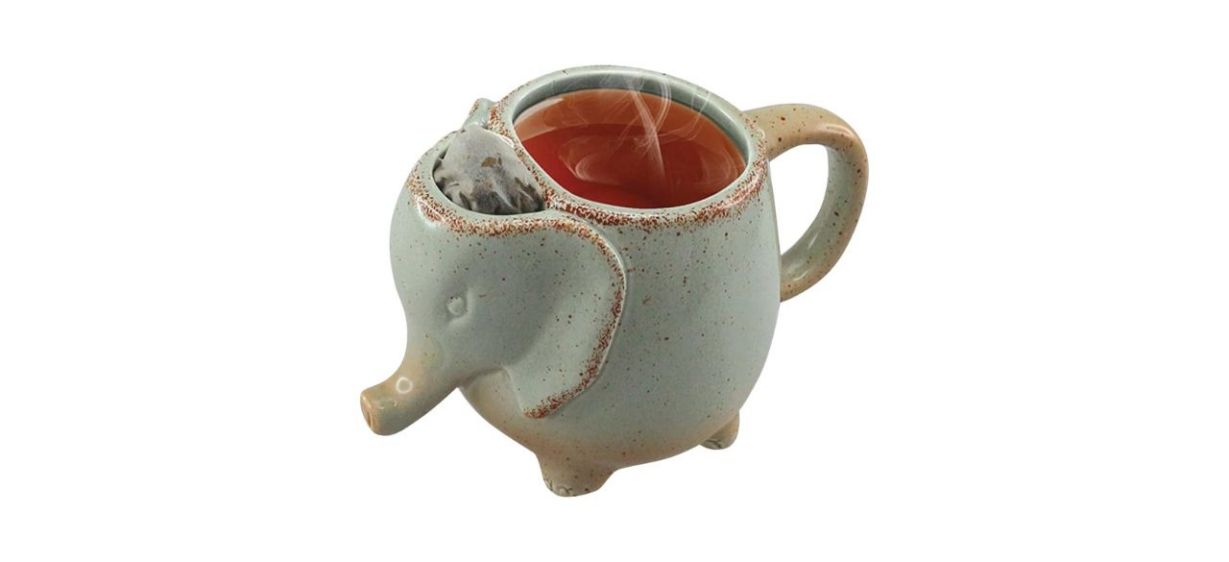 Happiness Apply Here Ceramic 15-Ounce Elephant Tea Mug, green, with tea in it