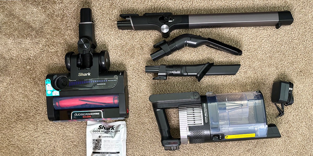 Shark Vertex Cordless with accessories on carpet