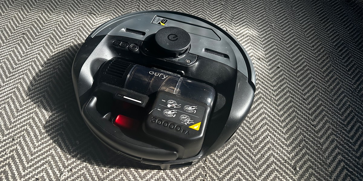 A robot vacuum on a zig-zag-patterned carpet