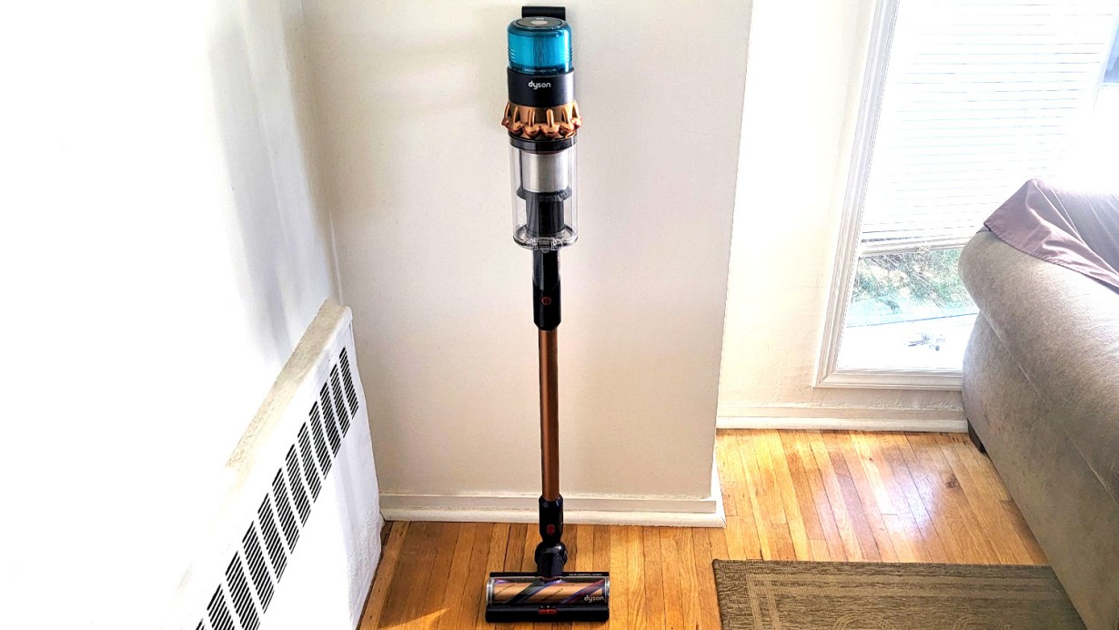 Dyson Gen5outsize Absolute leaning against the wall